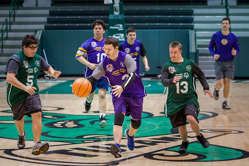 The Special Olympics Rivalry Basketball Game promotes fun and well-being through athletic competition.