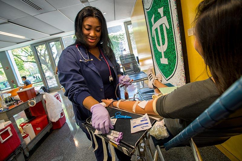  Student takes a timeout to give blood.
