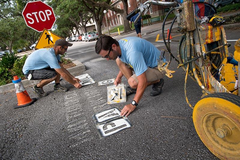 Fresh paint brightens up parking spaces on Newcomb Boulevard.