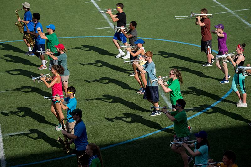 The Tulane University Marching Band (TUMB) braves the August heat and humidity to practice marching basics during the annual band camp on Brown Field.