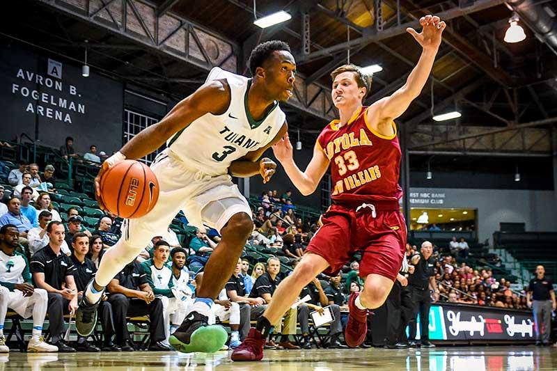 Ray Ona Embo, a Freshman guard from Lognes, France, drives to the basket in an exhibition match against neighboring Loyola at Avron B. Fogelman Arena in the Devlin Fieldhouse on Thursday (Nov.3).