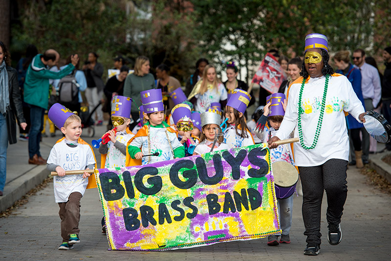Krewe of Newcomb rolls through the uptown campus spreading carnival cheer.