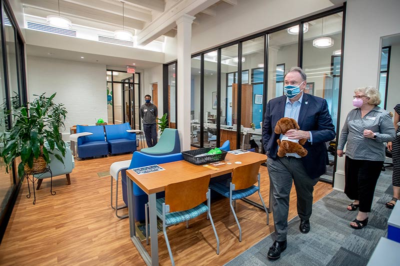 President Michael Fitts and Kelly Grant, senior associate dean for retention and strategic initiatives for Newcomb-Tulane College, walk through the spacious common area of the Carolyn Barber-Pierre Center for Intercultural Life.