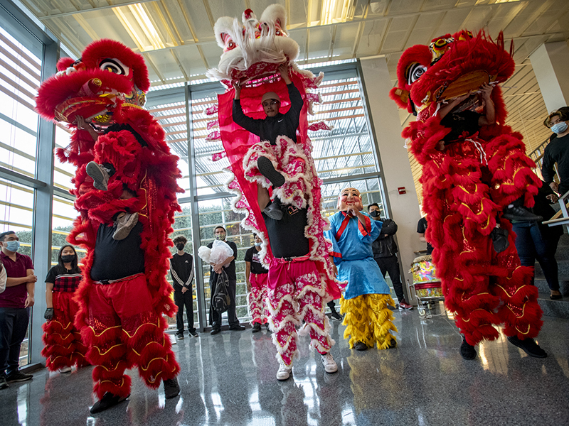 The Rising Dragon lion dance team performs acrobatic moves. From Marrero, the multi-ethnic troupe formed in 1994. Members of the group range in age from 14 to 25-years-old.