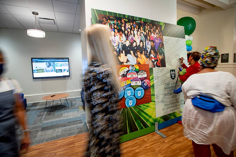 Visitors walk past the first floor waiting room as they tour the new facility. 