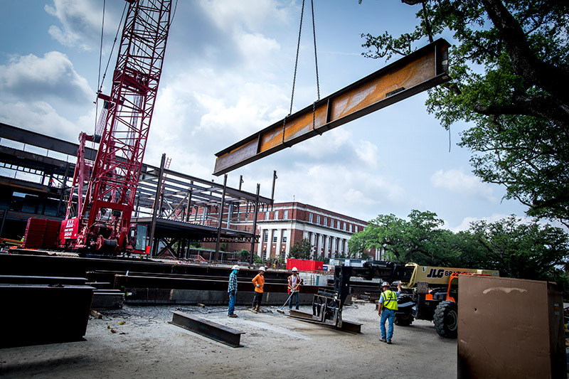 The Commons’ construction site is booming amid a relatively quiet uptown campus.