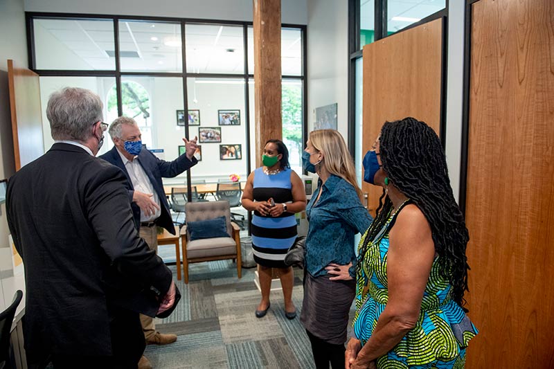Paula Booke (center), director of the Center of Academic Equity, leads a tour through the new space. Joining her are (from left to right) Dusty Porter, vice president for student affairs, Provost Robin Forman, Lee Skinner, Newcomb-Tulane College dean, and