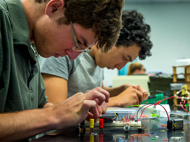 Mason Varuso, a senior at Patrick F. Taylor Science & Technology Academy, focuses on his project for Intro to Electronics, which is part of the Tulane Science Scholars Program for high school students to earn college credit. 