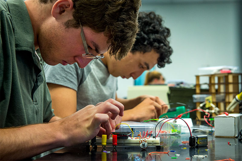 Mason Varuso, a senior at Patrick F. Taylor Science & Technology Academy, focuses on his project for Intro to Electronics, which is part of the Tulane Science Scholars Program for high school students to earn college credit. 