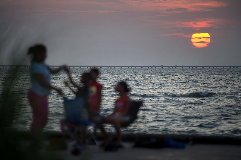 A lakefront sunset is a relaxing way to end the day.