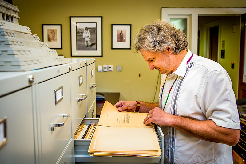 Marcello Canuto, director of Middle American Research Institute (MARI), views files from the 1920s that relate to the beginning of the institute. 