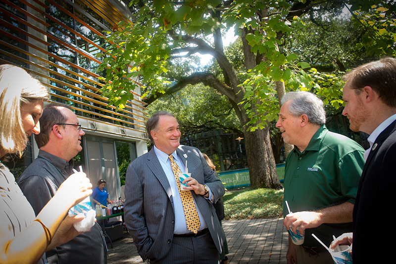 Staff members beat the heat while enjoying a conversation with Tulane President Mike Fitts. 