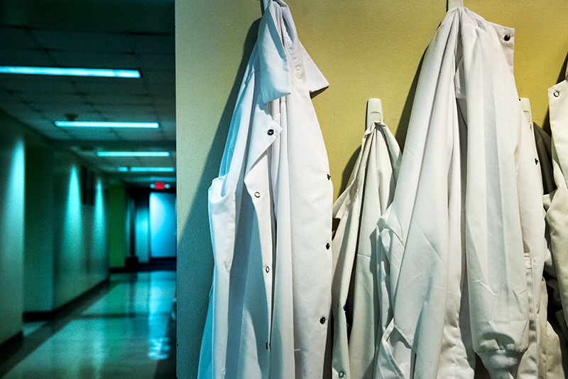 White coats hang outside a research lab in the Boggs Center for Energy & Biotechnology, one of several buildings that comprise the burgeoning uptown science district of the School of Science and Engineering. The School of Science and Engineering expands with the emergence of uptown science district.