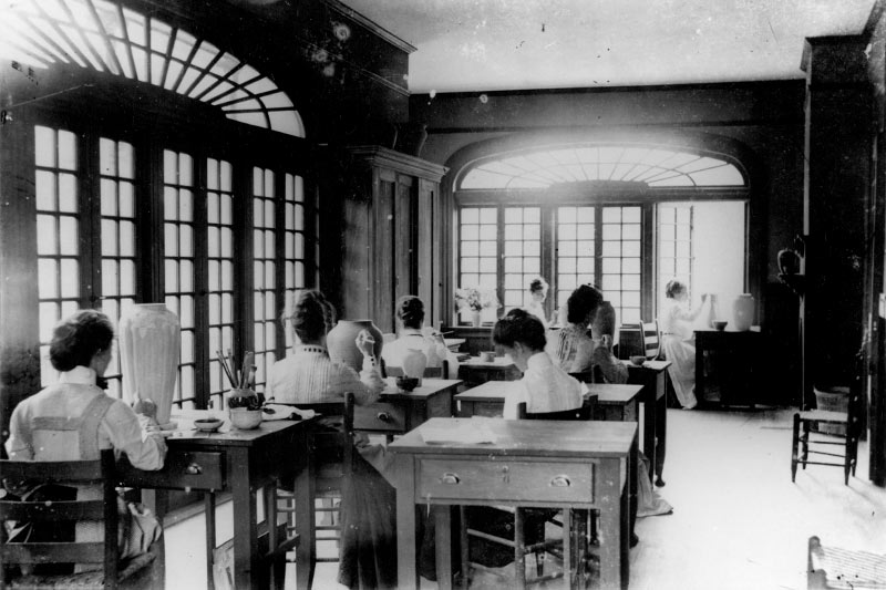 Early artists in the Newcomb College Pottery program Hattie Joor, Mary Richardson, Esther Elliot, Charlotte Payne, Effie Shepard, Mazie Ryan and Mary Butler work in the studio on the old Washington Avenue campus, circa 1905.