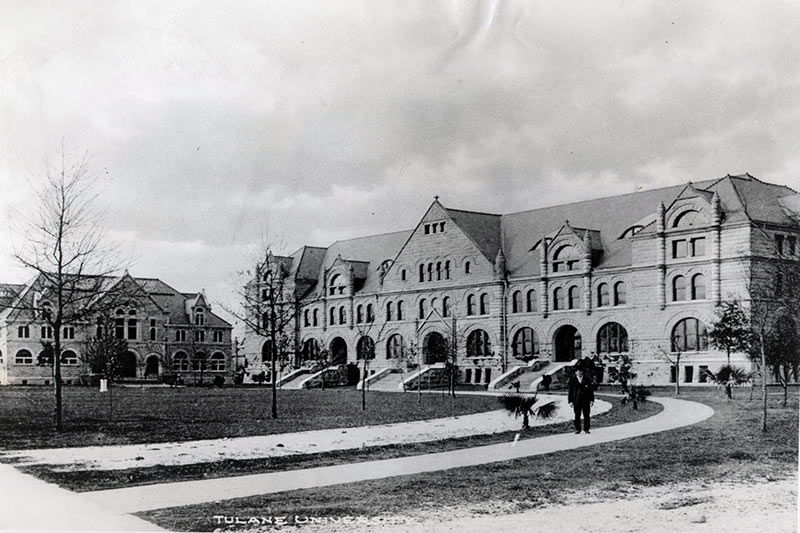An unidentified man poses near oak saplings planted in front of Gibson Hall and Tilton Memorial Hall in the early 1900s. An unidentified man poses near oak saplings planted in front of Gibson Hall and Tilton Memorial Hall in the early 1900s.