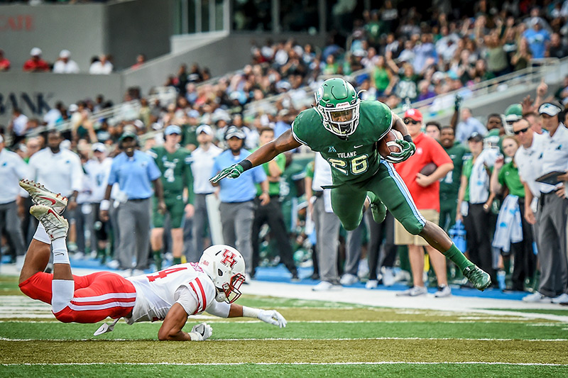 Green Wave holds on to bowl prospects with victory over Houston.