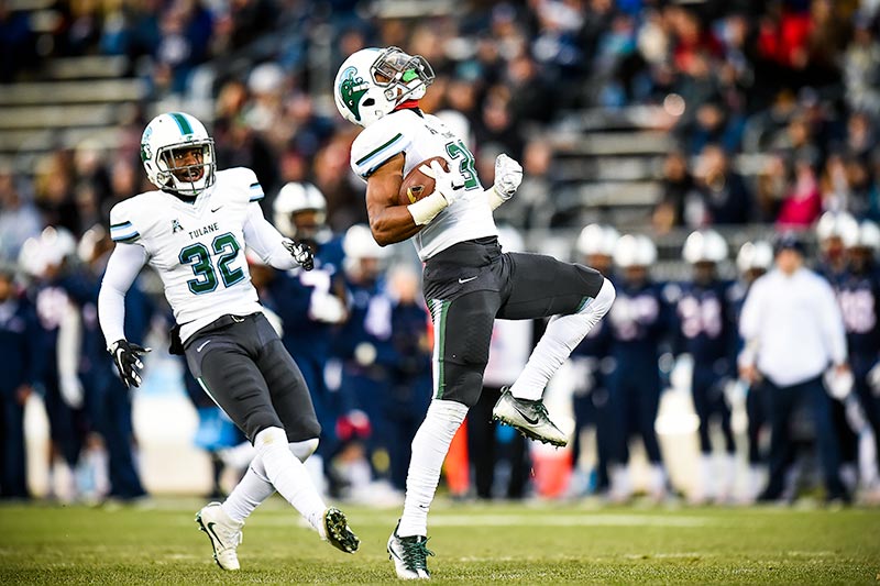 Larry Bryant, a freshman linebacker from Georgia, celebrates blocking and recovering a punt in the first quarter of the Green Wave’s 38-13 victory over UConn in East Hartford on Saturday (Nov. 26). 