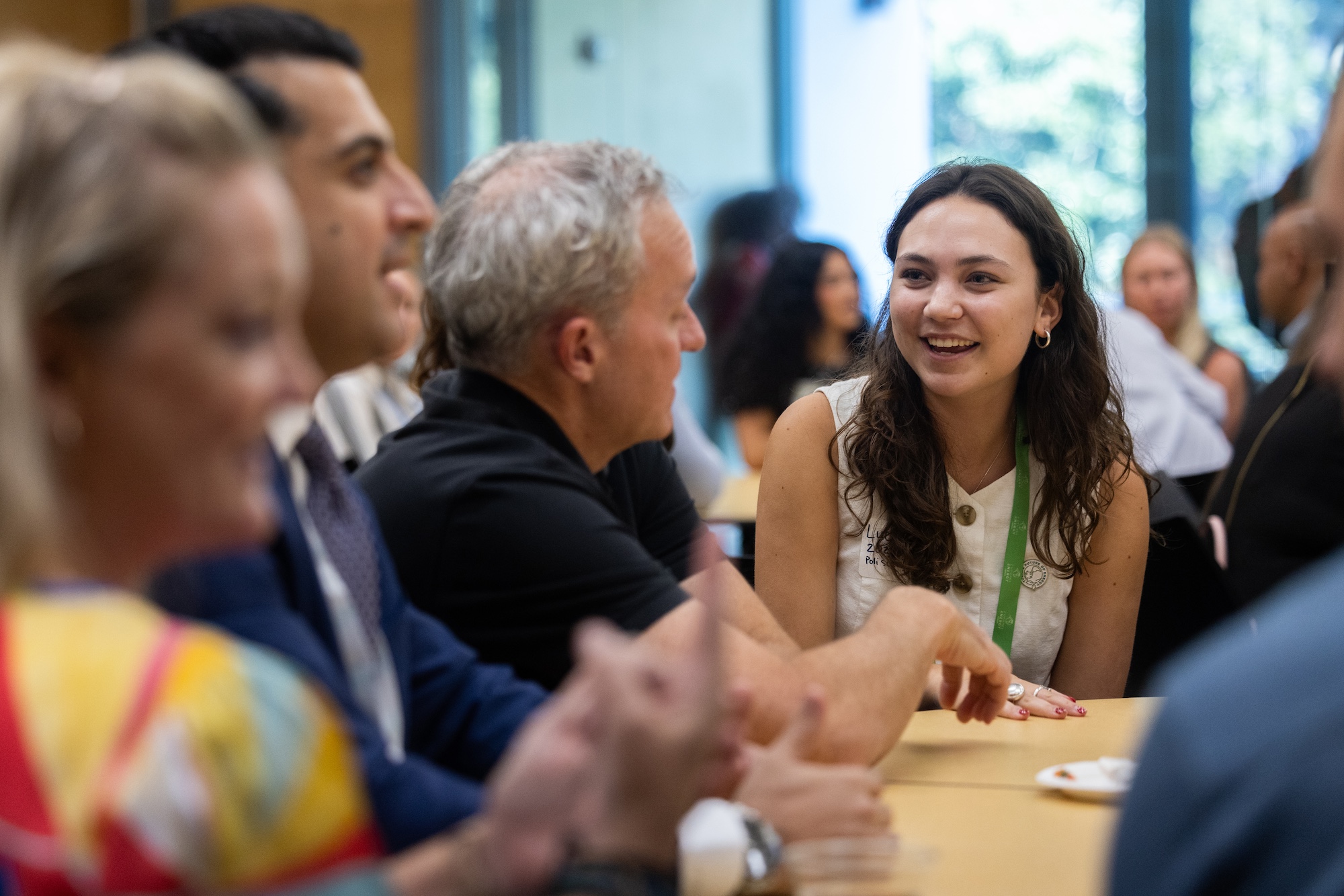 Attendees catch up between panels