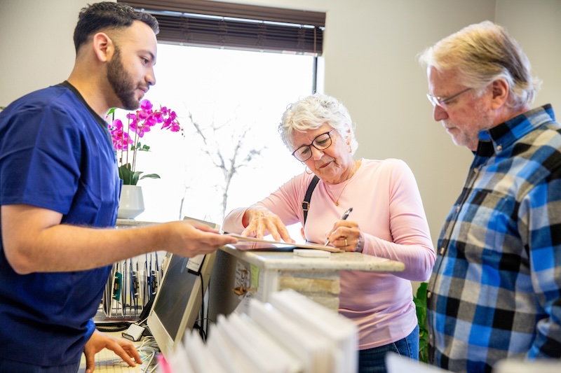 
A couple fills out medical paperwork 