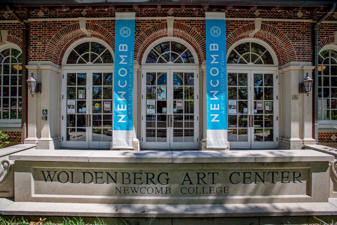 
Woldenberg Art Center entrance with arched doors and "Newcomb" banners. 
