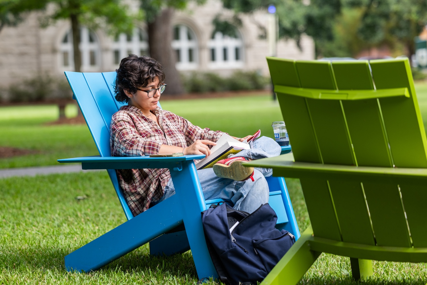 student reading on campus