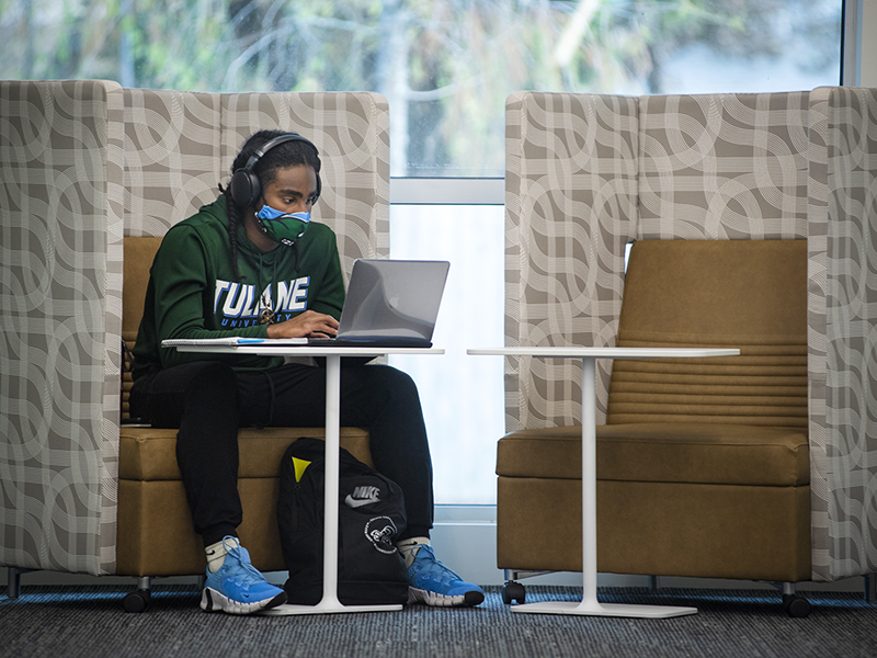 Kriston Esnard, first-year student and on the Green Wave football team, utilizes study space in the center. 
