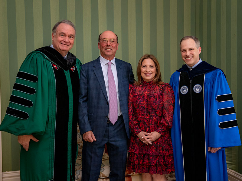 President Michael Fitts, Stuart and Suzanne Grant, and Michael Cohen