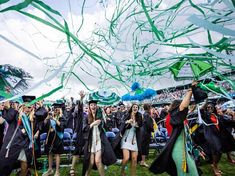 Students celebrate at the 2022 Unified Commencement Ceremony in Yulman Stadium
