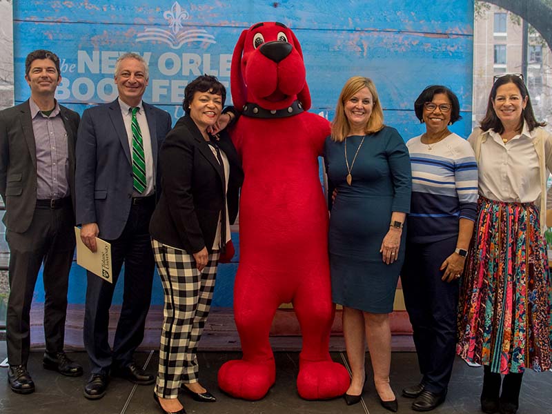 (l-r): Dr. Gabriel Morley, New Orleans Public Library, Robin Forman, Tulane University, New Orleans Mayor LaToya Cantrell, Clifford the Big Red Dog, Cheryl Landrieu, Co-Chair, Denise McConduit, children's author and Judy Newman, Scholastic.