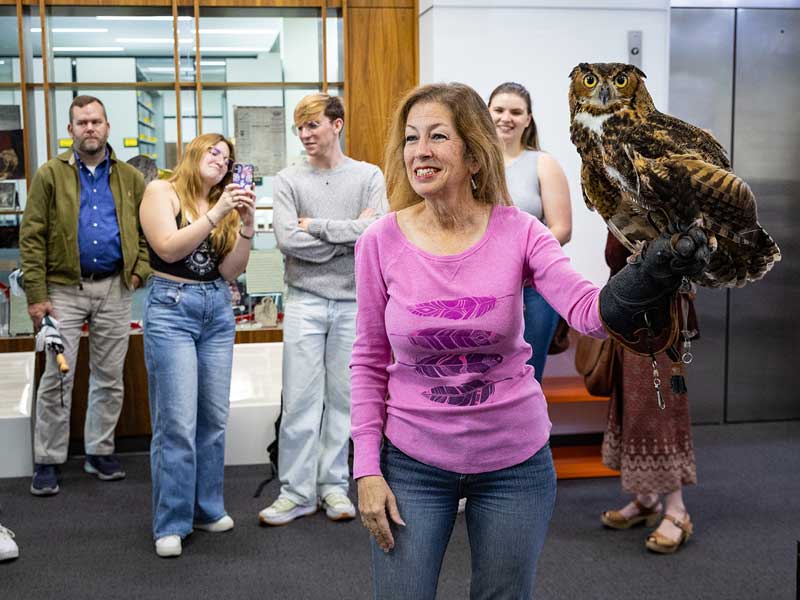 Jennifer Coulson from the Orleans Audubon Society gives a short presentation about great horned owls while holding Hamy.