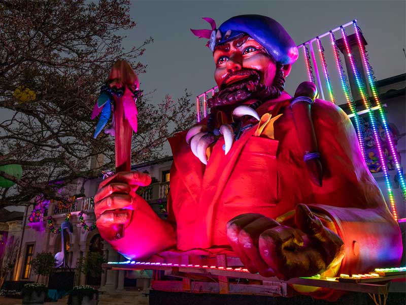 house float on St. Charles Ave. celebrates musicians such as Professor Longhair, Dr. John, and Louis Armstrong 
