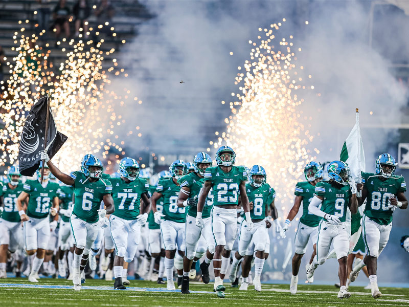 The Green Wave football team takes the field before the start of a football game against the University of Alabama at Birmingham.