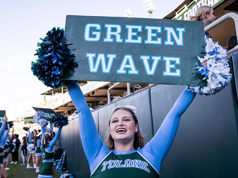 Green Wave cheerleader at Tulane Homecoming