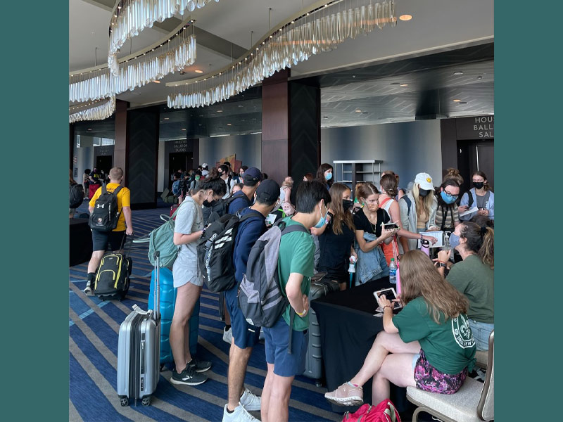 Students arrive at a Houston hotel and check-in with Tulane personnel and volunteers. 