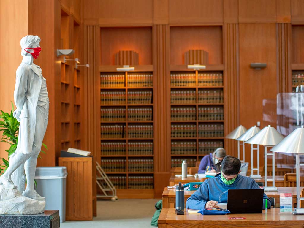 Masked students in Tulane Law Library