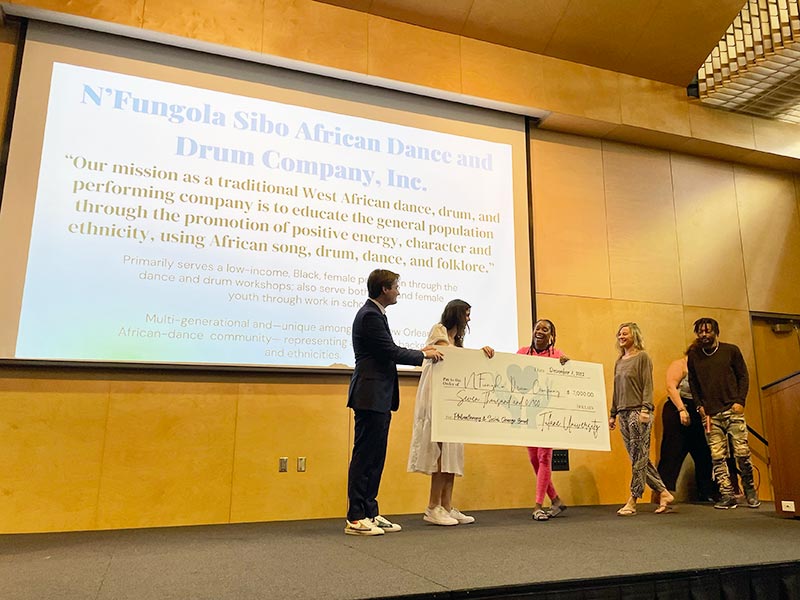 N'Fungola Sibo receives a grant from students in Tulane's Philanthropy and Social Change class
