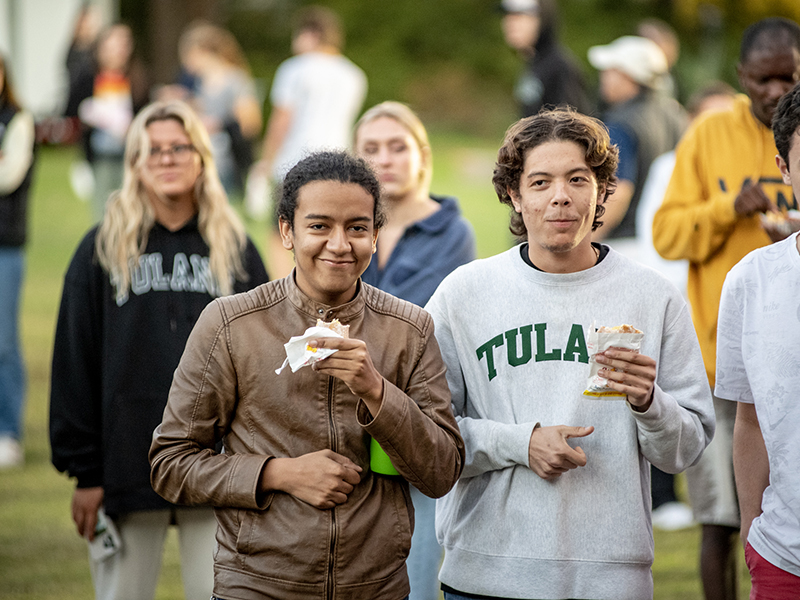 Students enjoy celebratory Hubig's pies given out during the event.