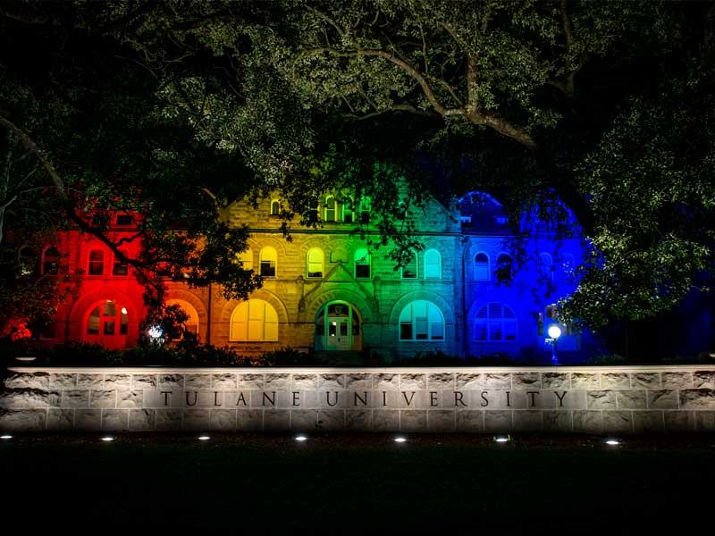 Lights adorn the front of Gibson Hall on the uptown campus to commemorate Pride Month. 