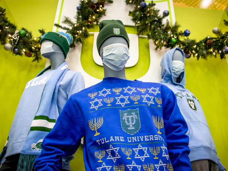 Tulane Bookstore display of holiday sweaters 
