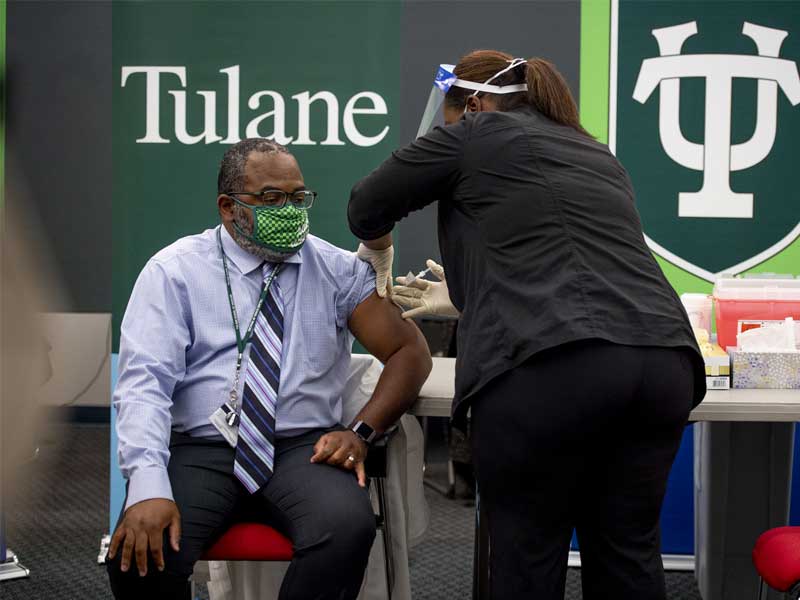 Marius Commodore, medical director of Tulane Campus Health, was first in line to receive the Pfizer-BioNTech COVID-19 vaccin