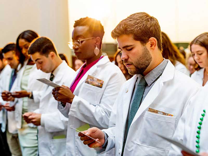 Medical students read the Tulane University Medical School oath, honoring the profession of medicine,