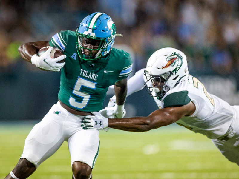 Tulane running back Ygeno Booker runs the ball against UAB.