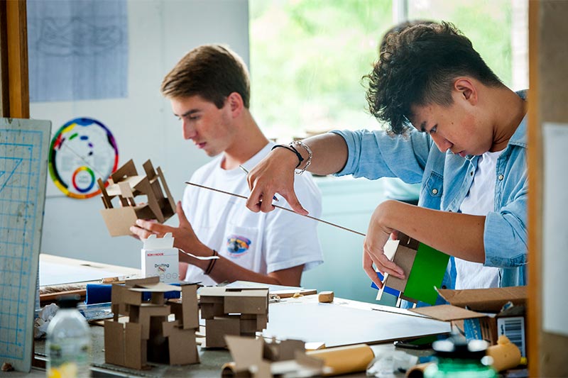 A.J. Whitney and Faxu Li, left to right, focus on their designs for Career Explorations in Architecture.
