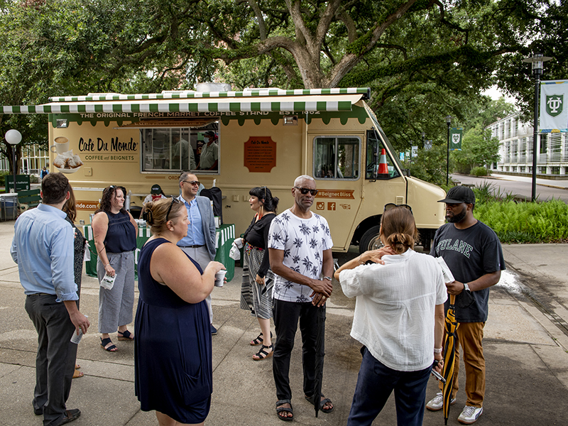 Tulane employees gather for coffee and beignets provided by Café du Monde on Tuesday morning (July 6), the first official day back to campus since March 2020.