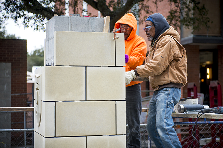 Seventh Ward craftsmen add a decorative touch to the back end of campus. 