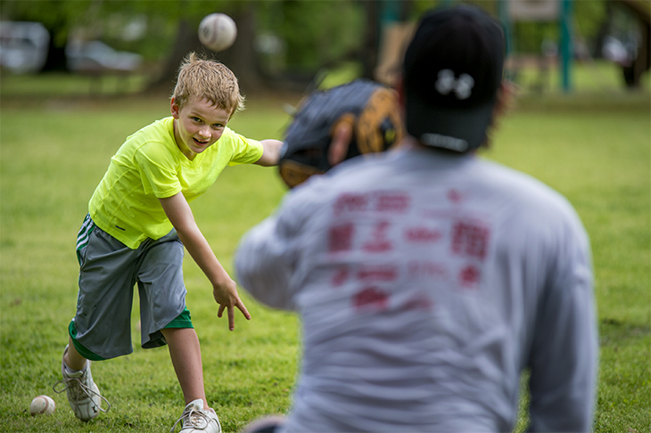 Father and son share a time-honored game in Audubon Park.