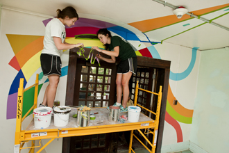 students painting mural