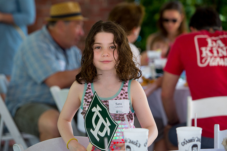 A young member of the Tulane community enjoys brunch.