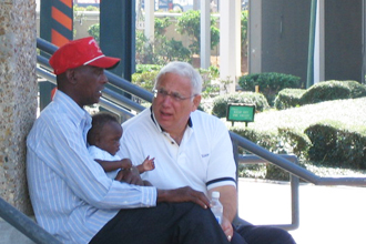 President Cowen talks with a citizen after Hurricane Katrina