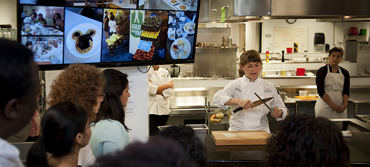 Leah Sarris, executive chef and program director of the Goldring Center for Culinary Medicine of Tulane University, sharpens a knife in a session designed to hone the skills of representatives from 13 universities and healthcare centers that have licensed the Goldring Center